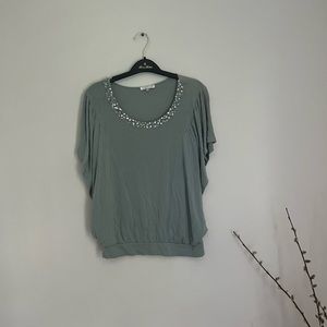 Good Look green top w/rhinestones around collar